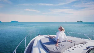 Traveler woman enjoying on the yacht in Southeast Asia